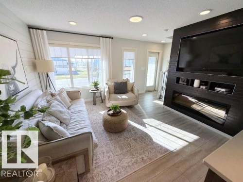 67 50 Mclaughlin Drive, Spruce Grove, AB - Indoor Photo Showing Living Room