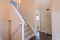 Stairway featuring wood-type flooring and baseboards - 