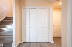 Staircase featuring wood finished floors and baseboards - 