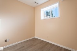 Spare room featuring wood finished floors and baseboards - 