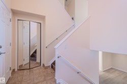 Stairs featuring baseboards and tile patterned flooring - 