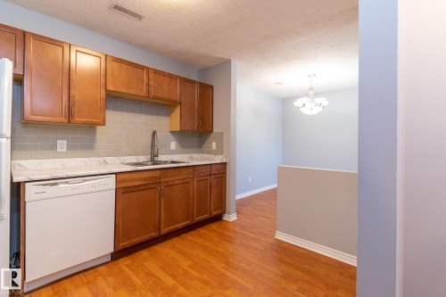 67 1503 Mill Woods Road, Edmonton, AB - Indoor Photo Showing Kitchen With Double Sink