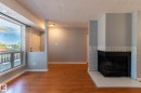67 1503 Mill Woods Road, Edmonton, AB  - Indoor Photo Showing Other Room With Fireplace 