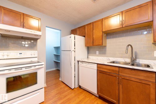 67 1503 Mill Woods Road, Edmonton, AB - Indoor Photo Showing Kitchen With Double Sink