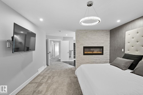 7520 173 Avenue, Edmonton, AB - Indoor Photo Showing Bedroom With Fireplace