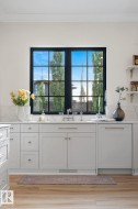 Doorway with ornamental molding and wood finished floors - 