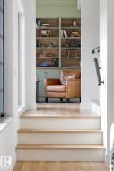 Staircase featuring wood finished floors - 