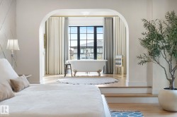 Bedroom with wood finished floors and baseboards - 