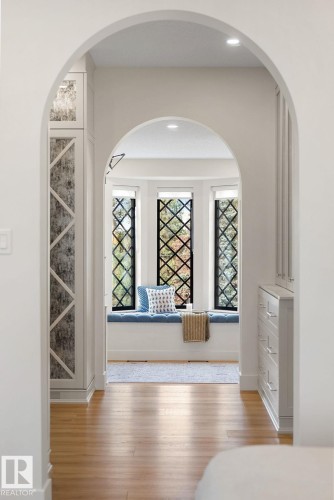 Hallway featuring healthy amount of natural light, arched walkways, and light wood-style flooring - 183 Windermere Drive, Edmonton, AB - Indoor Photo Showing Other Room