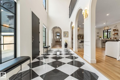 Foyer entrance featuring arched walkways, recessed lighting, and crown molding - 183 Windermere Drive, Edmonton, AB - Indoor