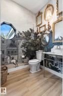 Bathroom with wallpapered walls and vanity - 