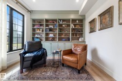 Sitting room featuring baseboards and light wood finished floors - 