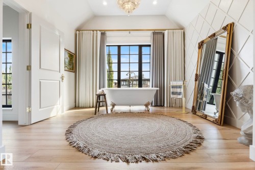 Sitting room with plenty of natural light, a chandelier, lofted ceiling, light wood-style floors, and recessed lighting - 183 Windermere Drive, Edmonton, AB - Indoor
