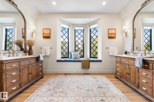 Full bath featuring two vanities, light wood-type flooring, and recessed lighting - 183 Windermere Drive, Edmonton, AB - Indoor Photo Showing Bathroom