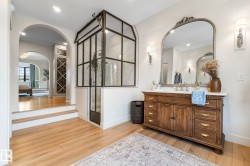 Bathroom with vanity, light wood finished floors, a stall shower, and recessed lighting - 
