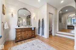 Full bathroom featuring vanity, light wood finished floors, recessed lighting, and connected bathroom - 