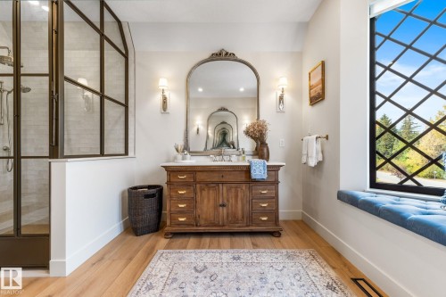 Bathroom with vanity, light wood finished floors, and a stall shower - 183 Windermere Drive, Edmonton, AB - Indoor Photo Showing Other Room