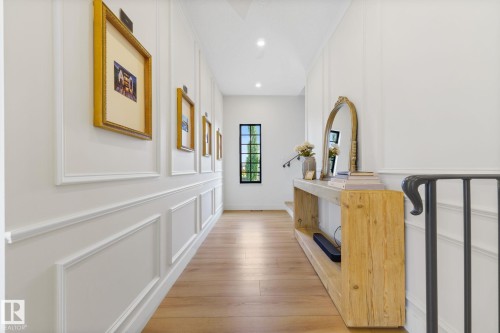 Hall with light wood-style floors, recessed lighting, and a decorative wall - 183 Windermere Drive, Edmonton, AB - Indoor Photo Showing Other Room