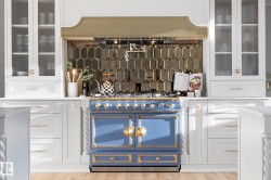 Bar area featuring glass insert cabinets, white cabinetry, backsplash, premium range hood, and gas range - 