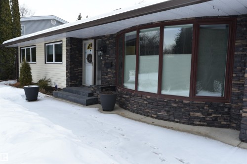 View of front of property with stone siding - 13910 101A Avenue, Edmonton, AB - Outdoor