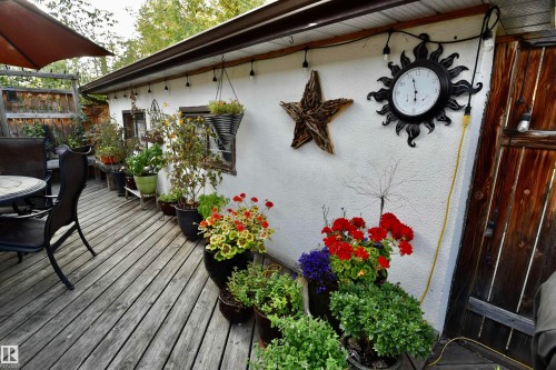 Wooden terrace featuring outdoor dining space - 13910 101A Avenue, Edmonton, AB - Outdoor With Deck Patio Veranda With Exterior