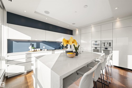 Kitchen with modern cabinets, white cabinetry, light stone counters, and recessed lighting - 3201 11969 Jasper Avenue, Edmonton, AB - Indoor