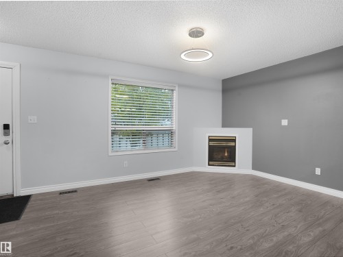 1608 Mill Woods Road E, Edmonton, AB - Indoor Photo Showing Other Room With Fireplace