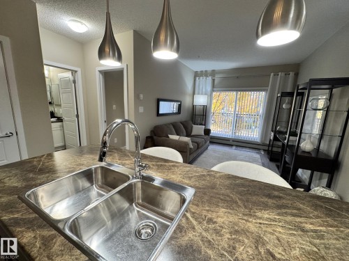 218 508 Griesbach Parade, Edmonton, AB - Indoor Photo Showing Kitchen With Double Sink