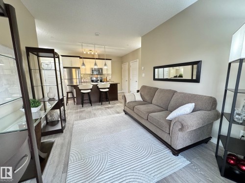 218 508 Griesbach Parade, Edmonton, AB - Indoor Photo Showing Living Room