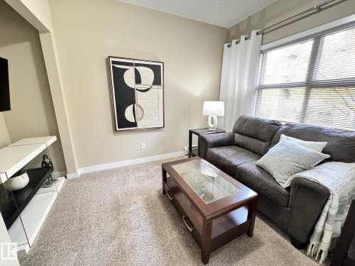 218 508 Griesbach Parade, Edmonton, AB - Indoor Photo Showing Living Room