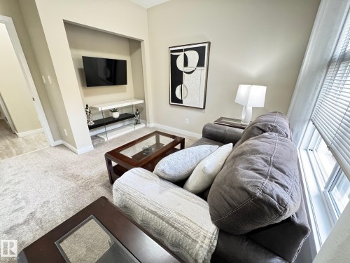 218 508 Griesbach Parade, Edmonton, AB - Indoor Photo Showing Living Room