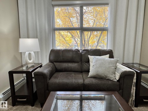 218 508 Griesbach Parade, Edmonton, AB - Indoor Photo Showing Living Room