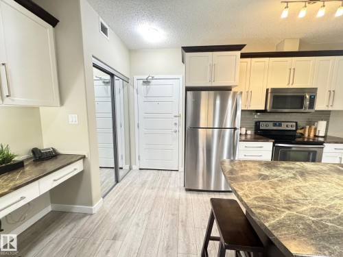 218 508 Griesbach Parade, Edmonton, AB - Indoor Photo Showing Kitchen With Stainless Steel Kitchen