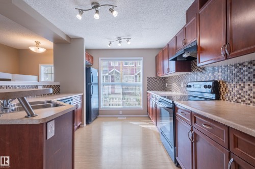 143 5604 199 Street, Edmonton, AB - Indoor Photo Showing Kitchen With Double Sink