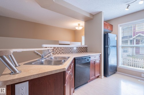 143 5604 199 Street, Edmonton, AB - Indoor Photo Showing Kitchen With Double Sink