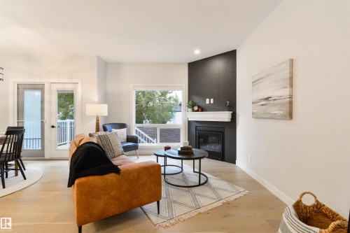 13 1005 Calahoo Road, Spruce Grove, AB - Indoor Photo Showing Living Room With Fireplace