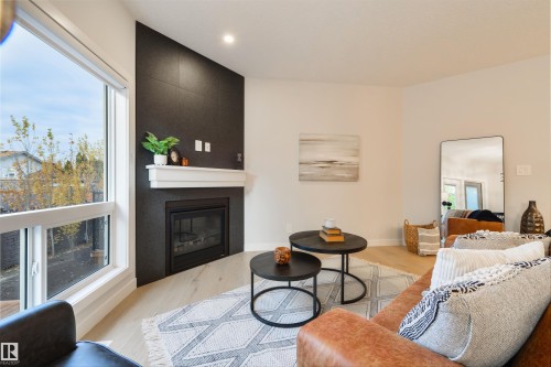 13 1005 Calahoo Road, Spruce Grove, AB - Indoor Photo Showing Living Room With Fireplace