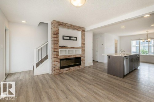 838 Daniels Way, Edmonton, AB - Indoor Photo Showing Living Room With Fireplace