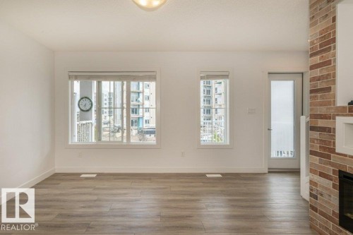 838 Daniels Way, Edmonton, AB - Indoor Photo Showing Other Room With Fireplace