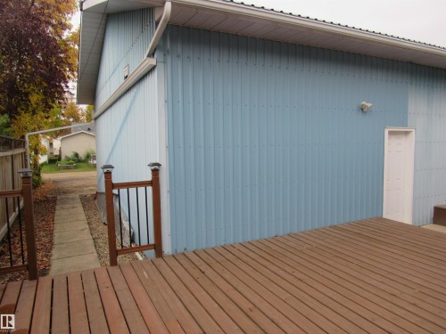 View of wooden deck - 5016 51 Street, Barrhead, AB - Outdoor With Exterior