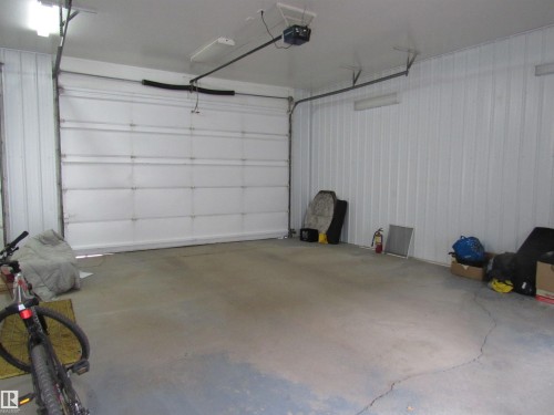 Garage featuring a garage door opener - 5016 51 Street, Barrhead, AB - Indoor Photo Showing Garage