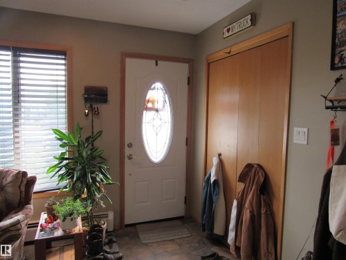 Foyer featuring a baseboard heating unit - 5016 51 Street, Barrhead, AB - Indoor Photo Showing Other Room