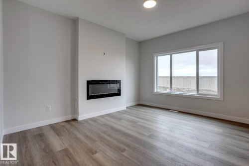 165 Caledon Crescent, Spruce Grove, AB - Indoor Photo Showing Living Room With Fireplace