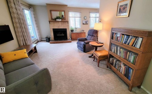 206 10826 113 Street, Edmonton, AB - Indoor Photo Showing Living Room With Fireplace