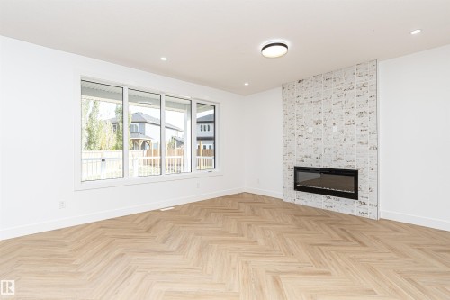 3221 Pelerin Crescent, Beaumont, AB - Indoor Photo Showing Living Room With Fireplace