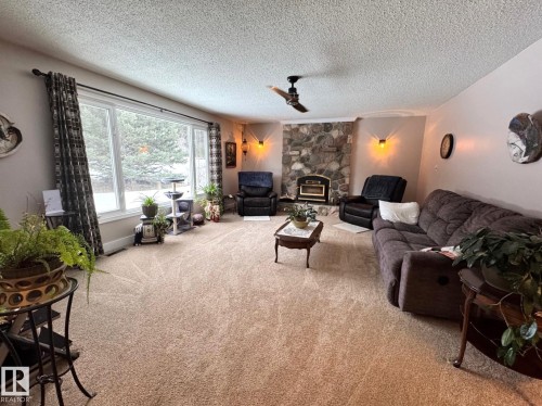 4911 46 St, Evansburg, AB - Indoor Photo Showing Living Room With Fireplace