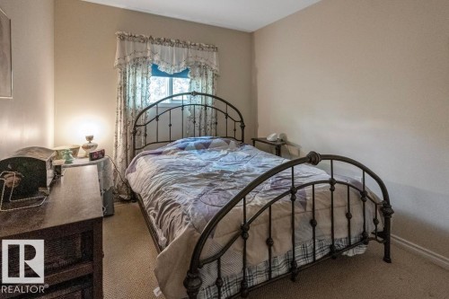 Main floor bedroom - 218 58532 Range Road 113, Rural St. Paul County, AB - Indoor Photo Showing Bedroom