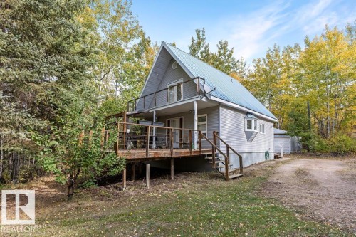 Back of house featuring a metal roof - 218 58532 Range Road 113, Rural St. Paul County, AB - Outdoor With Balcony