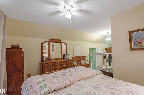 Bedroom with a ceiling fan - 218 58532 Range Road 113, Rural St. Paul County, AB - Indoor Photo Showing Bedroom