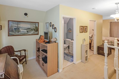 Corridor featuring light colored carpet and baseboards - 218 58532 Range Road 113, Rural St. Paul County, AB - Indoor